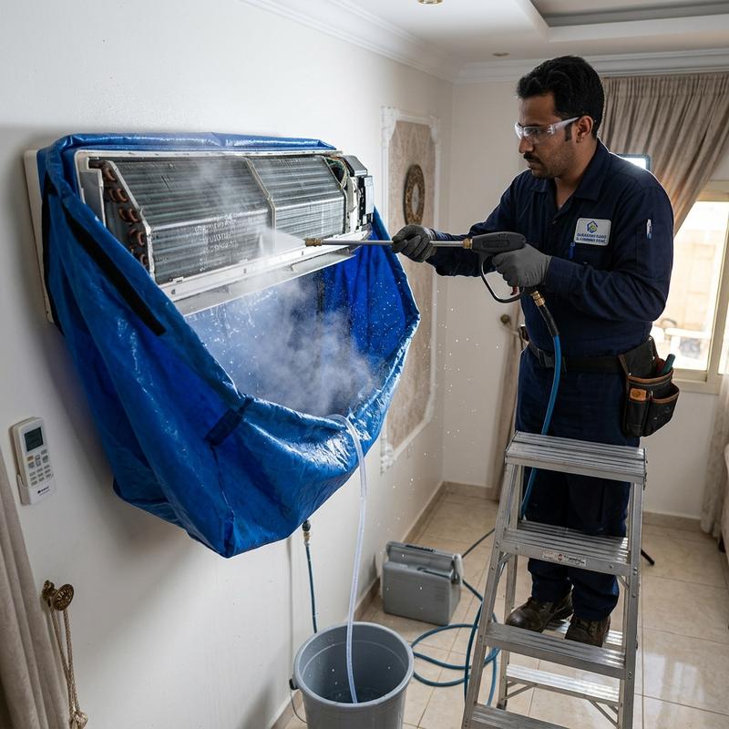 Technician performing deep high-pressure wash on split AC unit using protective wash bag
